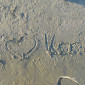 I love Konfi in Sand geschrieben